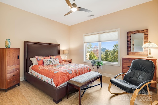 bedroom with ceiling fan and light wood-type flooring