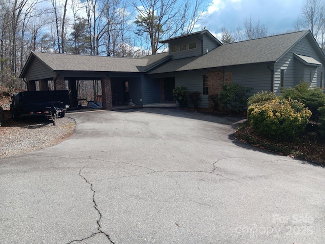 single story home with a carport