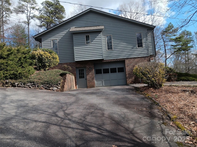 view of side of property featuring a garage