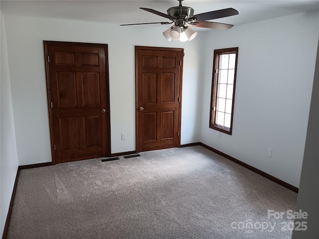 unfurnished bedroom with carpet flooring and ceiling fan