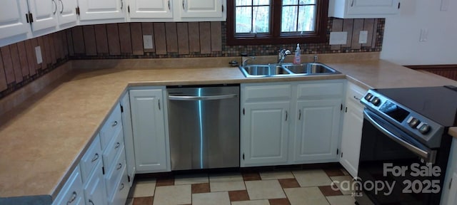 kitchen featuring electric range, dishwasher, white cabinetry, and sink