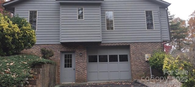 view of property exterior with a garage