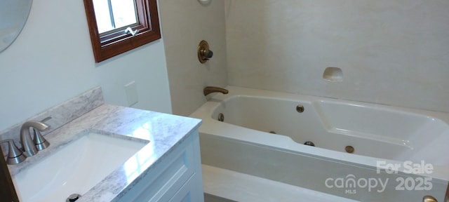 bathroom featuring vanity and a bathtub