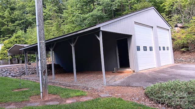 view of outbuilding with a garage and a carport