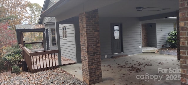 entrance to property featuring a patio