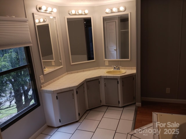 bathroom featuring tile patterned floors and vanity