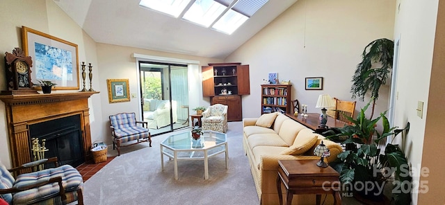 living room featuring a fireplace with flush hearth, a skylight, and high vaulted ceiling