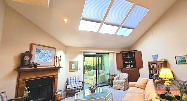 living area with lofted ceiling with skylight, a fireplace, carpet flooring, and recessed lighting