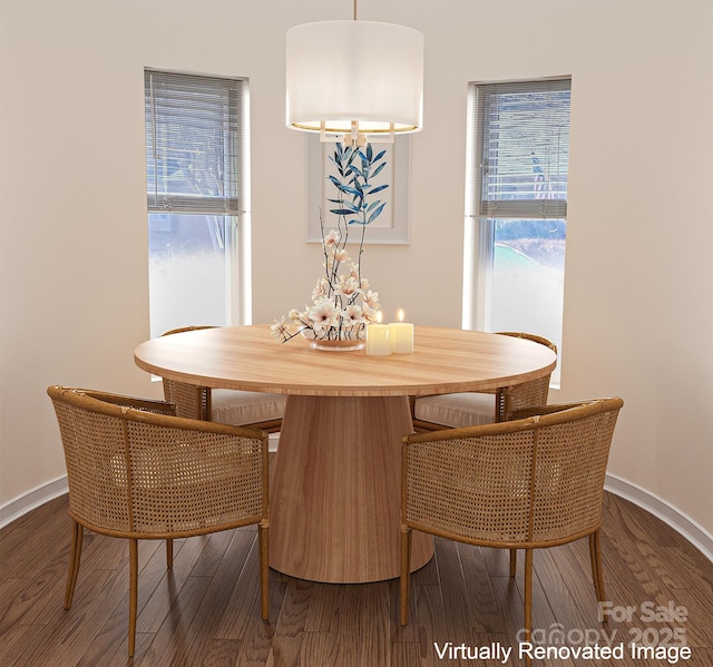 dining space with baseboards and dark wood-style flooring