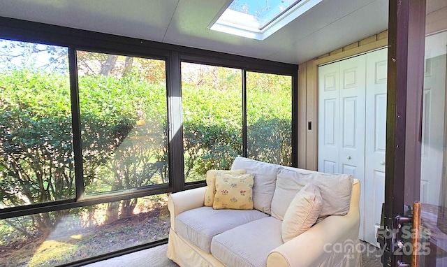 sunroom with lofted ceiling with skylight