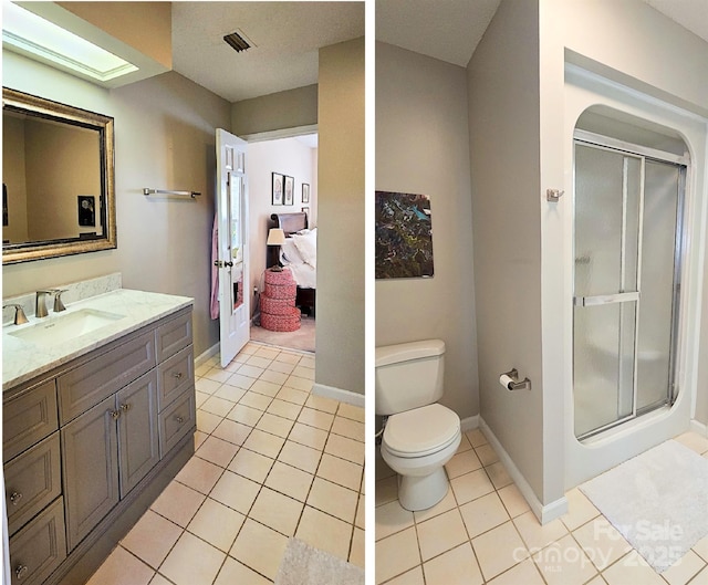 bathroom featuring visible vents, toilet, a stall shower, vanity, and tile patterned floors