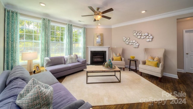 living room featuring crown molding, ceiling fan, and dark hardwood / wood-style flooring