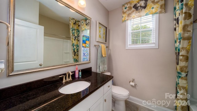 full bathroom with vanity, toilet, and shower / tub combo with curtain