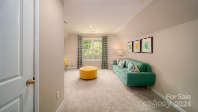 interior space with lofted ceiling and carpet floors