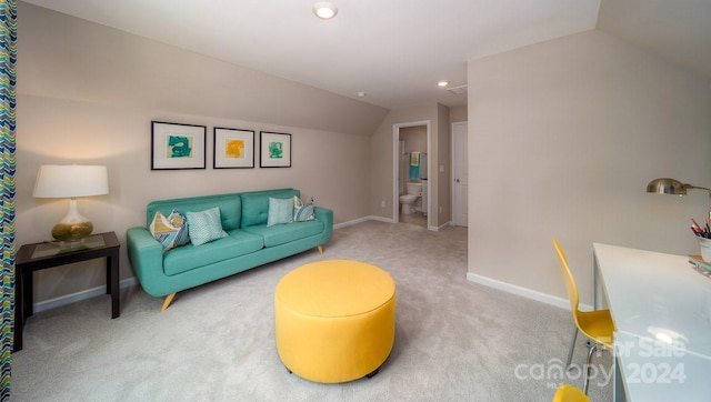 living room with carpet flooring and vaulted ceiling