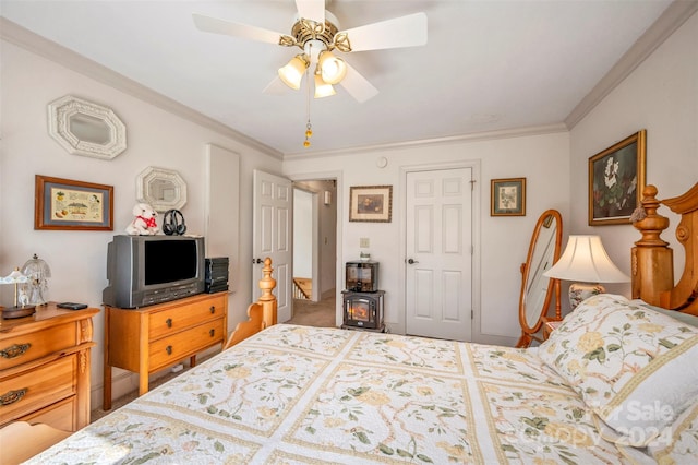 bedroom featuring a closet, ceiling fan, and ornamental molding