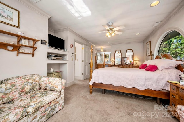 bedroom with ceiling fan, crown molding, and light colored carpet