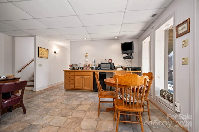 dining room featuring a paneled ceiling