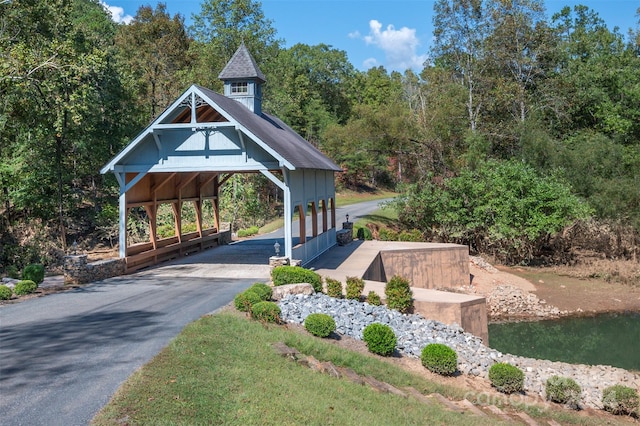 view of home's community with a water view