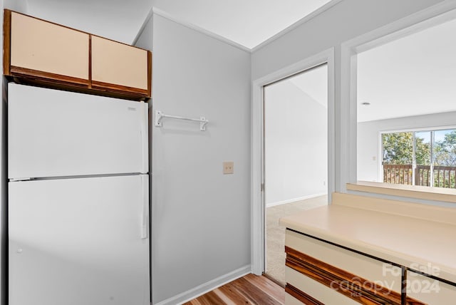 kitchen featuring white fridge and light hardwood / wood-style floors