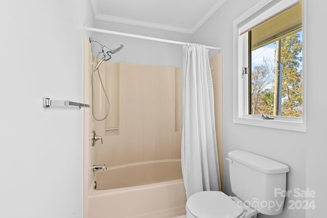 bathroom featuring a wealth of natural light, shower / tub combo with curtain, ornamental molding, and toilet