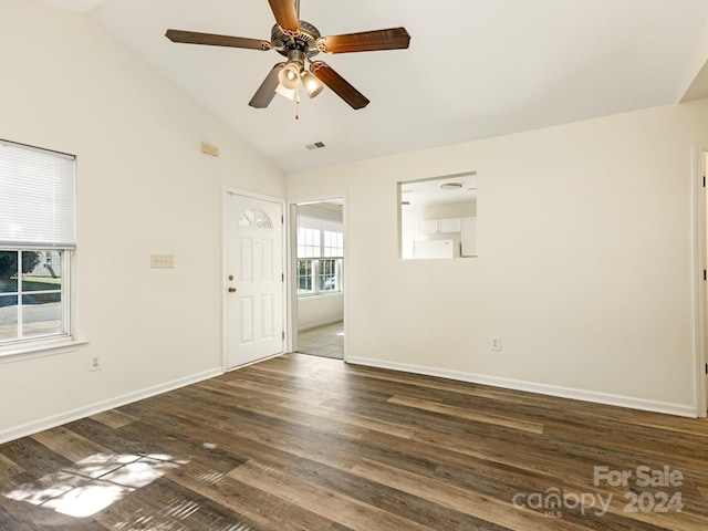 empty room featuring ceiling fan, high vaulted ceiling, and dark hardwood / wood-style floors