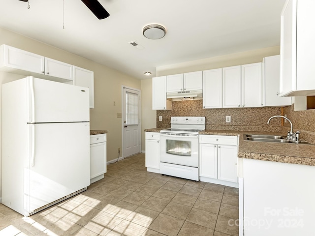 kitchen featuring white appliances, sink, backsplash, ceiling fan, and white cabinets