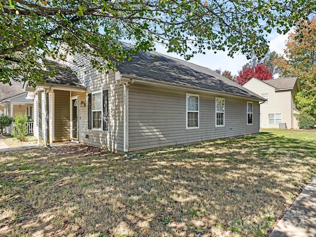 view of home's exterior with a yard