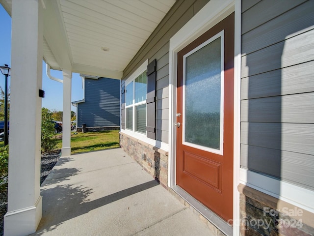 property entrance with covered porch