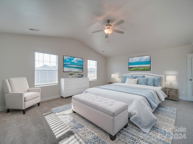 carpeted bedroom featuring lofted ceiling and ceiling fan