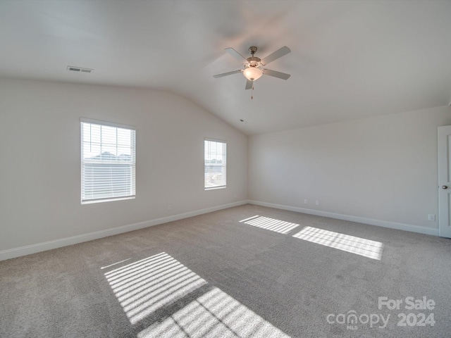 interior space featuring lofted ceiling and ceiling fan