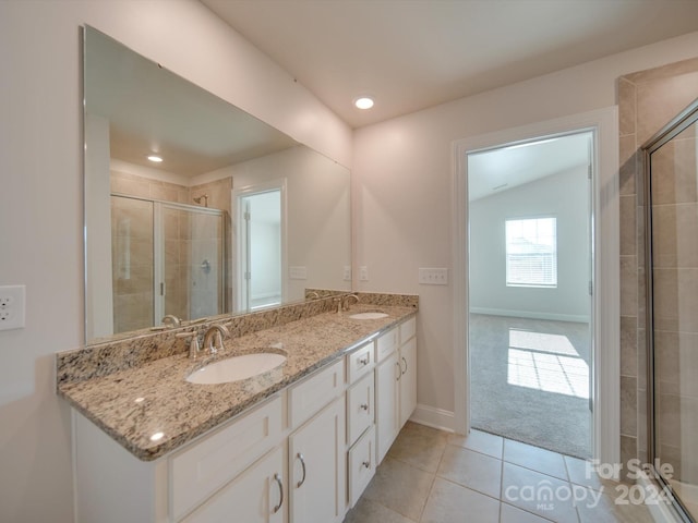 bathroom with vanity, tile patterned flooring, an enclosed shower, and vaulted ceiling