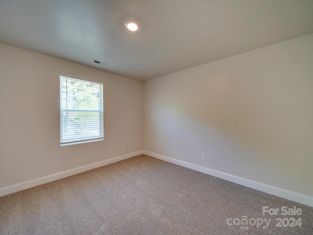 view of carpeted spare room