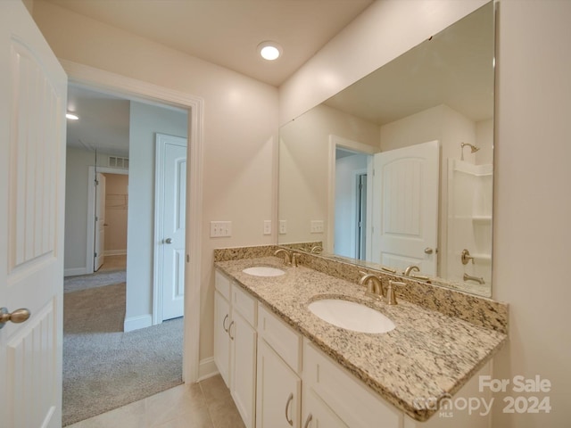 bathroom with vanity and tile patterned floors