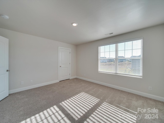 view of carpeted spare room