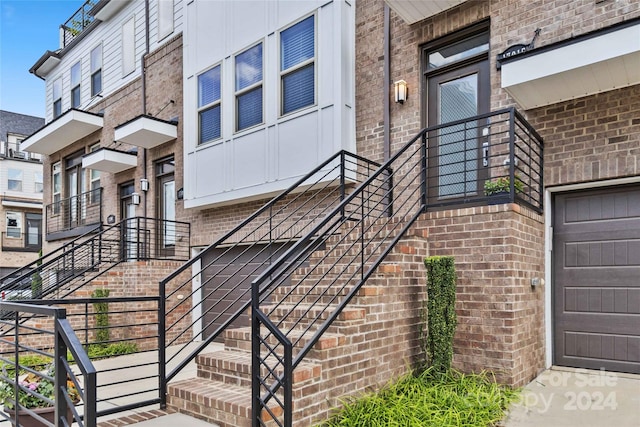 view of exterior entry with a garage