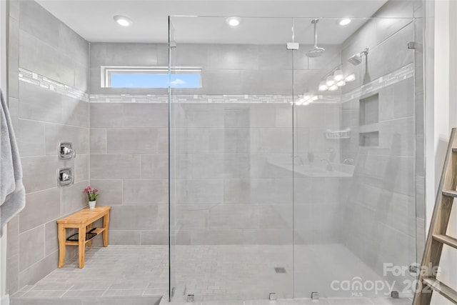 bathroom with a shower with shower door