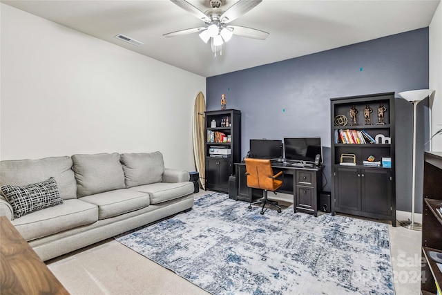 office space featuring ceiling fan and carpet