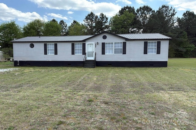 manufactured / mobile home featuring a front yard, metal roof, and crawl space