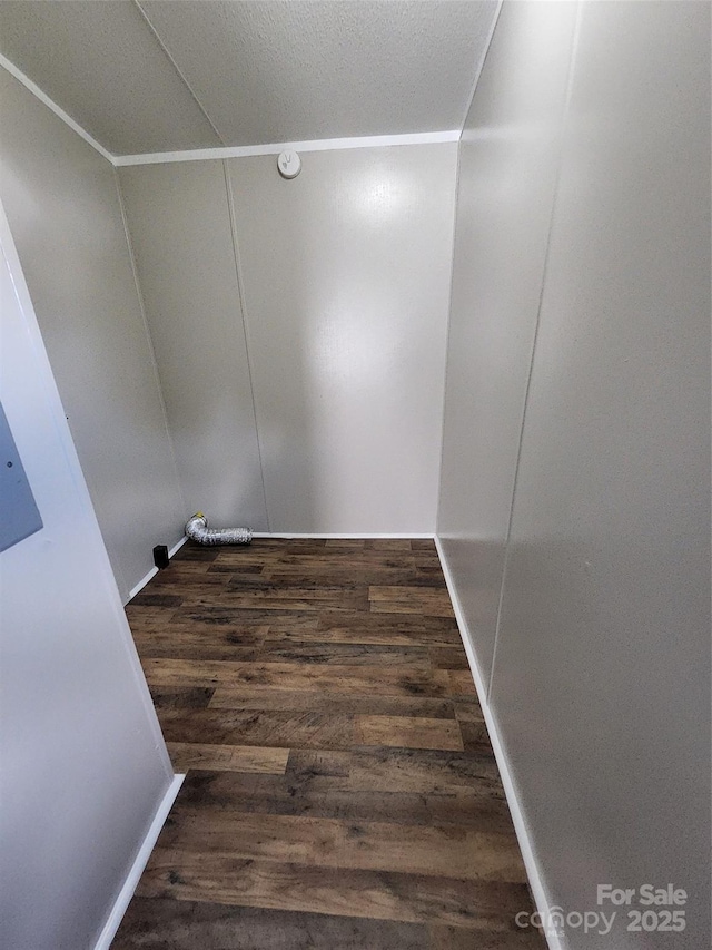unfurnished room with wood finished floors