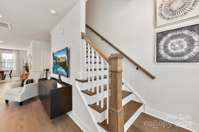 stairway featuring hardwood / wood-style floors