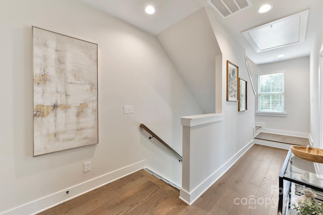 stairway featuring hardwood / wood-style flooring