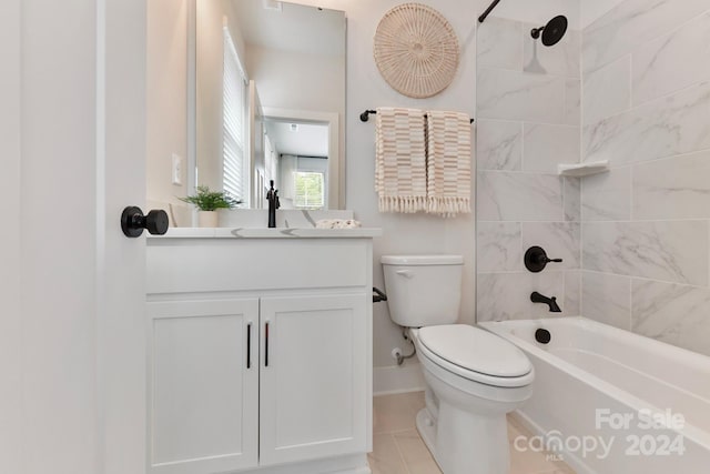 full bathroom featuring vanity, toilet, tile patterned flooring, and tiled shower / bath