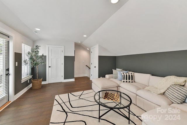 living room with lofted ceiling and dark hardwood / wood-style flooring