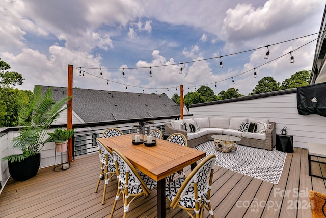 deck featuring outdoor lounge area