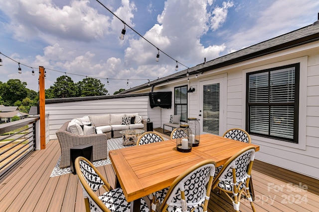 wooden deck featuring an outdoor hangout area