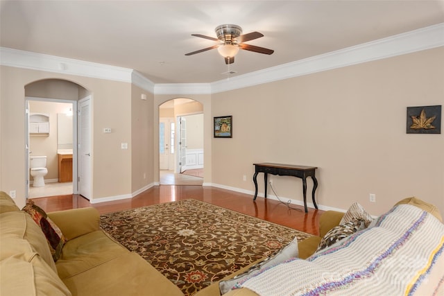 living room with ornamental molding, hardwood / wood-style flooring, and ceiling fan