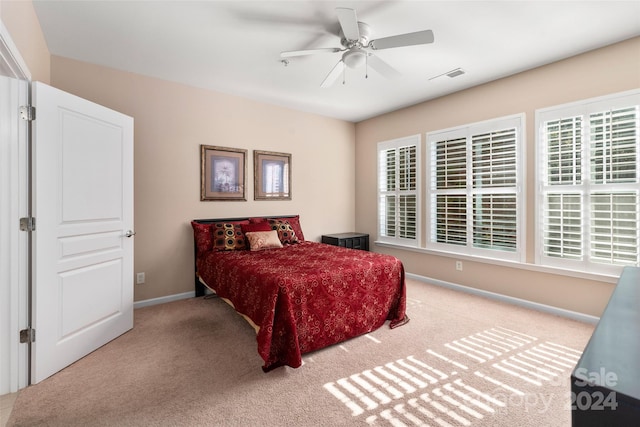 bedroom with ceiling fan and carpet floors