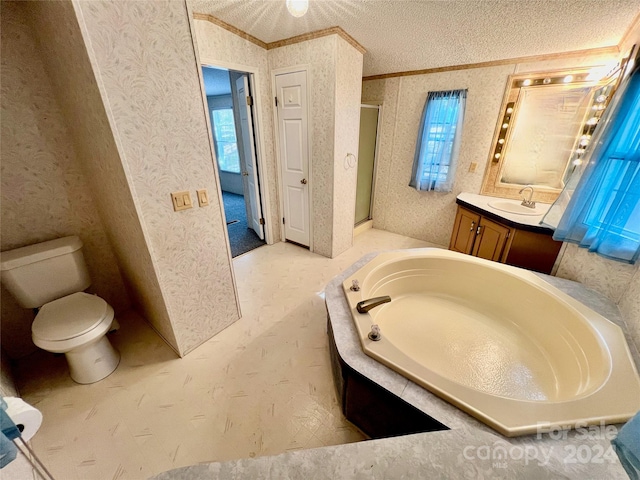 full bathroom with a textured ceiling, independent shower and bath, toilet, vanity, and ornamental molding