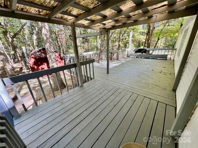 wooden terrace with a pergola